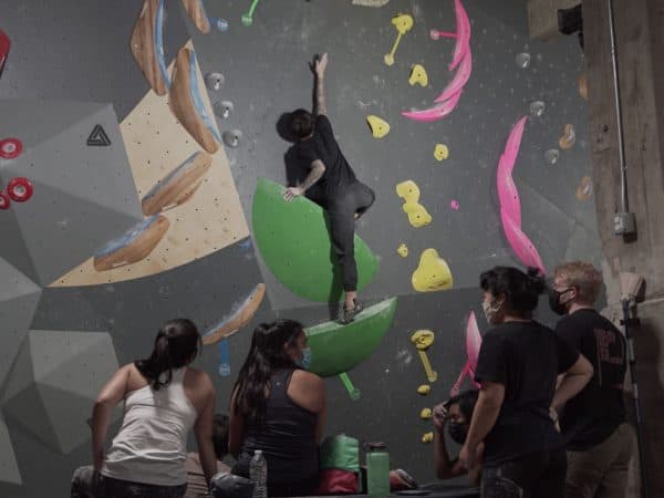 Man rock climbing indoor