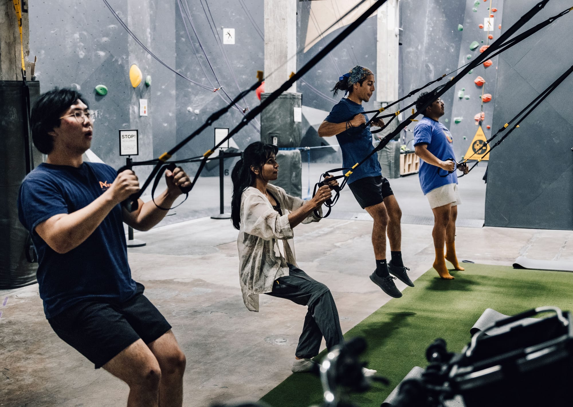 Members training with TRX straps